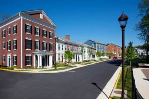 A base range of five unit types received layered treatments of a variety of materials, details, and colors to achieve a varied streetscape. Simplifying the unit types significantly reduced construction costs. (Torti Gallas & Partners)