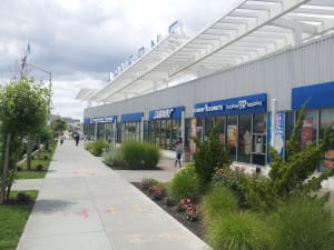 The community is oriented toward the retail/transit plaza, which includes 21,600 square feet of retail space, with an elevated transit station directly behind it.