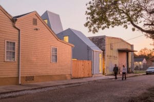 The form of the home reflects the profile found on a traditional creole cottage while materially aligned with the industrial character of the street, photo: William Crocker